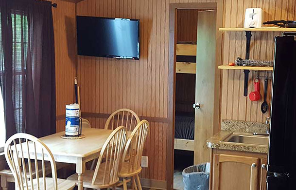 Deluxe cabin dining area at Adventure Bound Southwoods